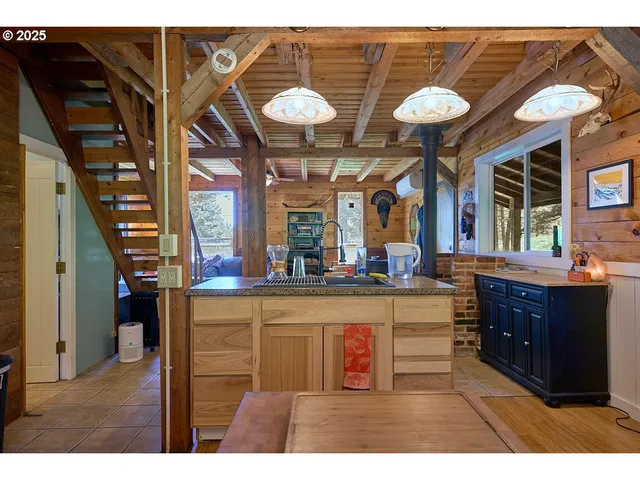 a view of a kitchen and an window
