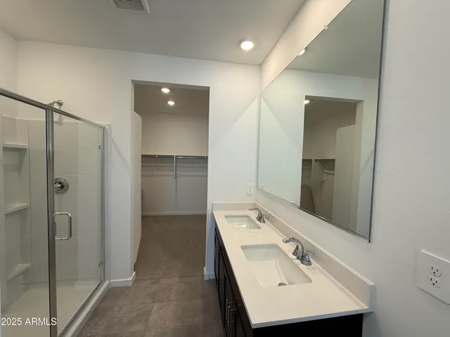 a bathroom with a sink and mirror