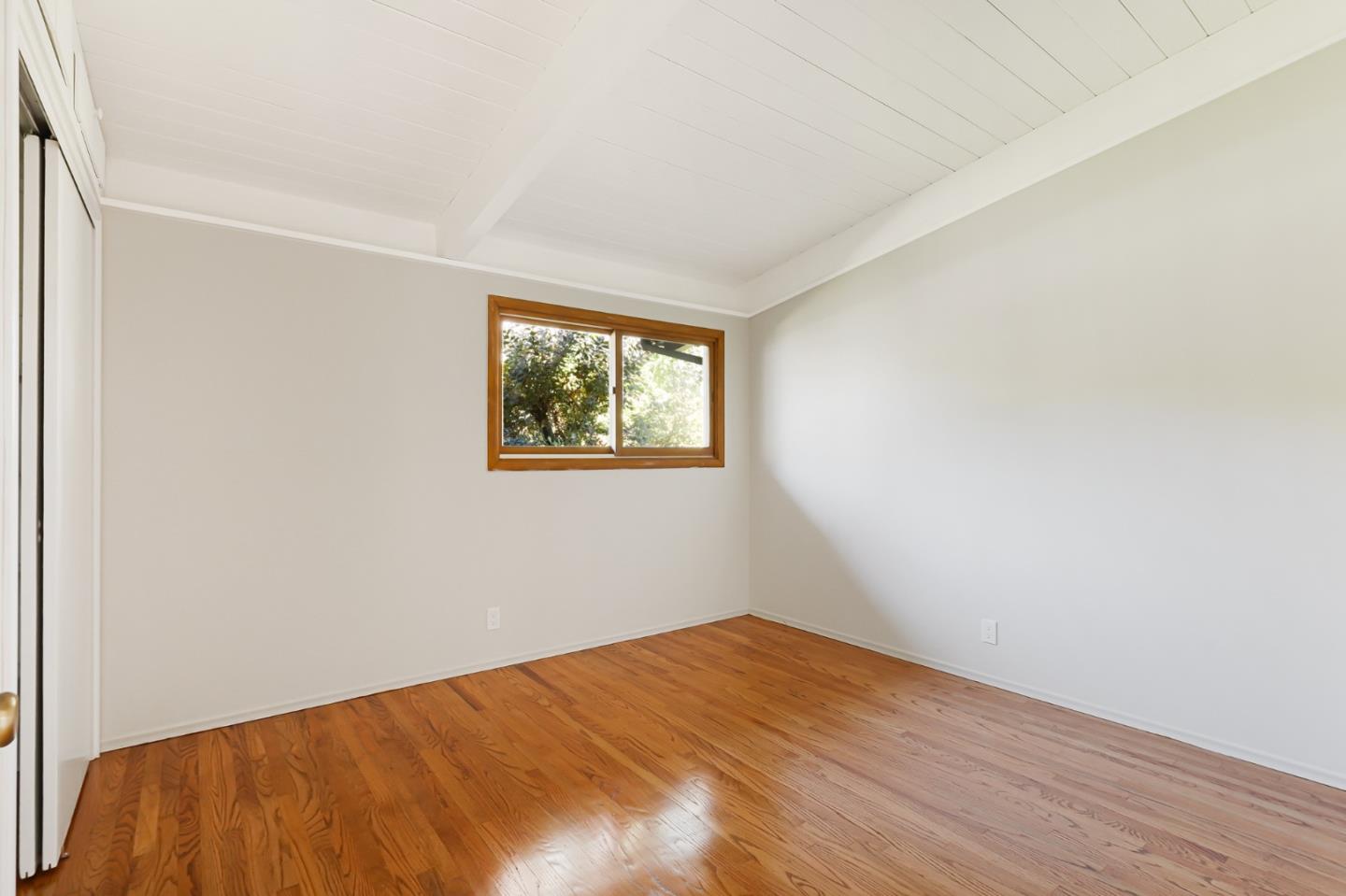 3955 Bibbits Drive Palo Alto, CA 94303 - Photo 21 of 42 a view of empty room with wooden floor