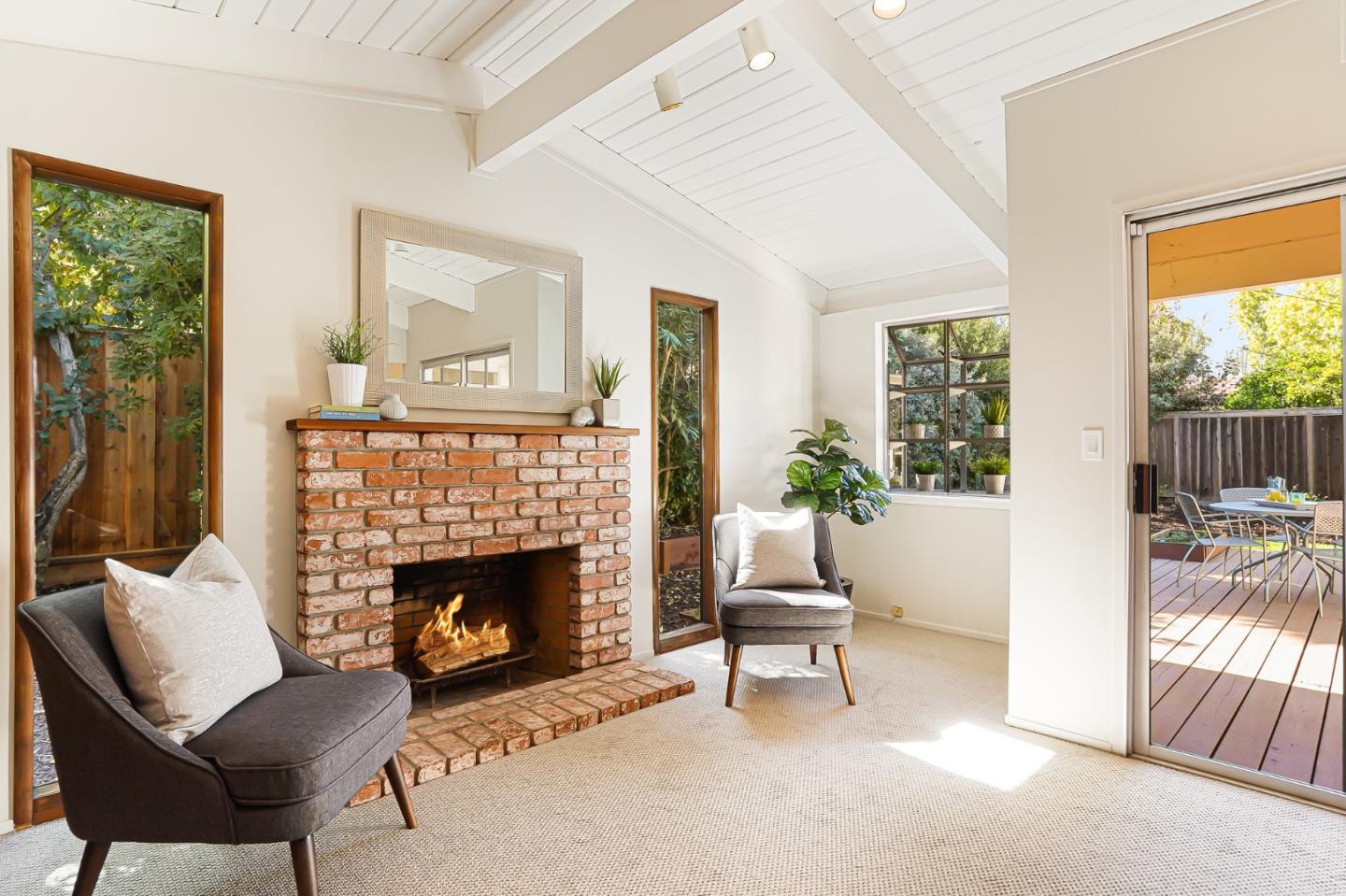 3955 Bibbits Drive Palo Alto, CA 94303 - Photo 31 of 42 a living room with furniture and a fireplace