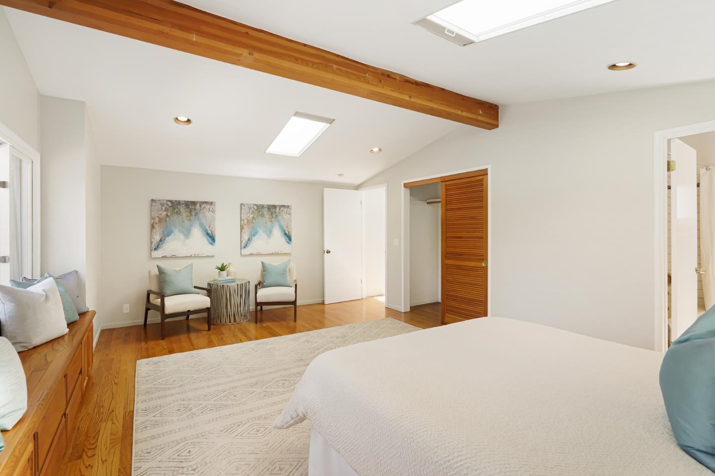 3955 Bibbits Drive Palo Alto, CA 94303 - Photo 33 of 42 a bedroom with a large bed and wooden floor