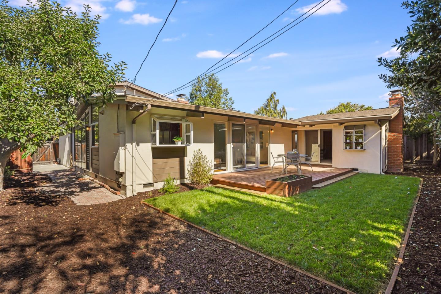 3955 Bibbits Drive Palo Alto, CA 94303 - Photo 38 of 42 a view of a house with backyard porch and sitting area
