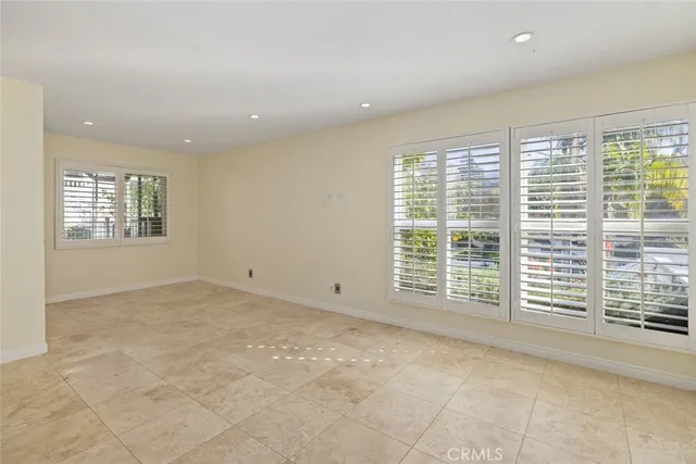 a spacious bathroom with a double vanity sink a mirror and a shower
