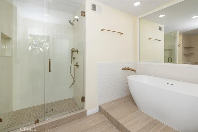 a bathroom with a double vanity sink a mirror and a