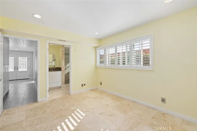 a bathroom with a granite countertop sink a mirror and a shower