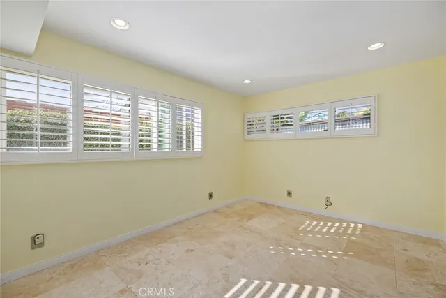 a bathroom with a granite countertop sink a mirror and a shower