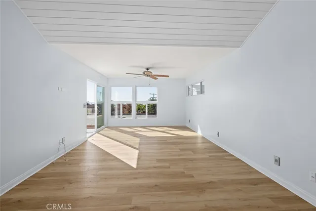 a view of a livingroom with wooden floor