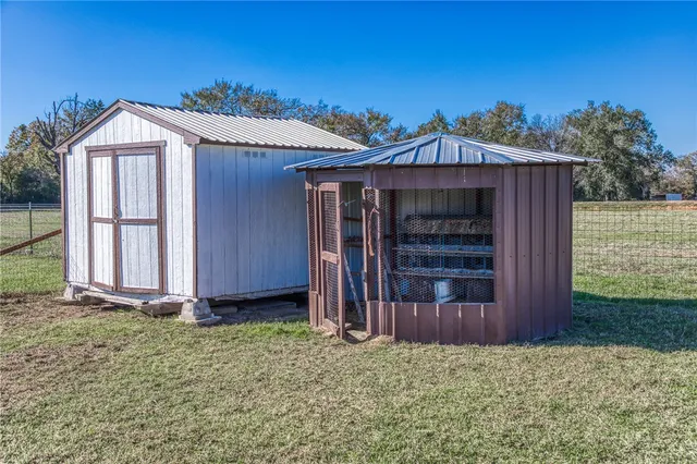 an aerial view of residential house with beach