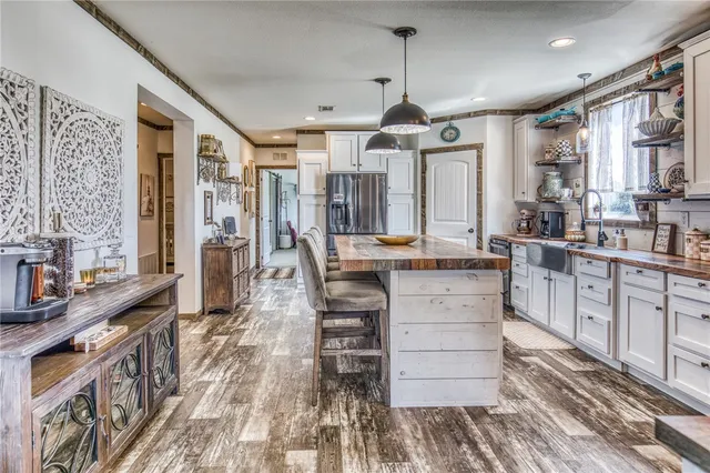a dining room with furniture and wooden floor