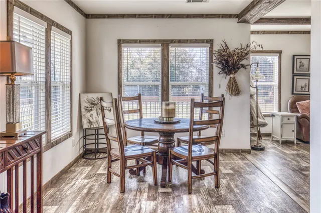 a dining room with furniture and window