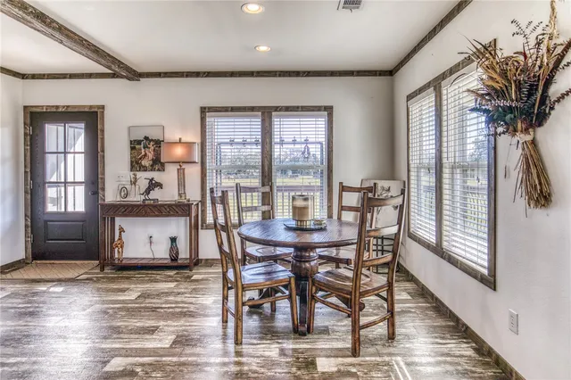 a bedroom with a bed couch and window
