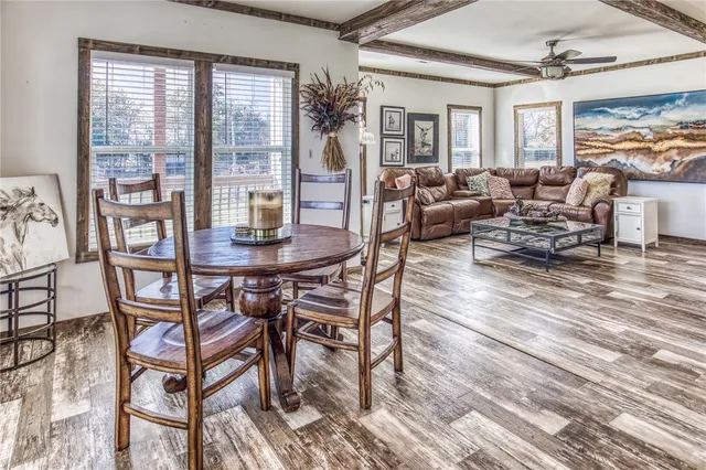 a view of a livingroom with furniture and staircase