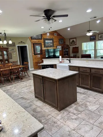 a bedroom with a bed mirror and window