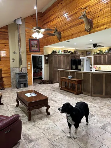 a large kitchen with a stove and a sink