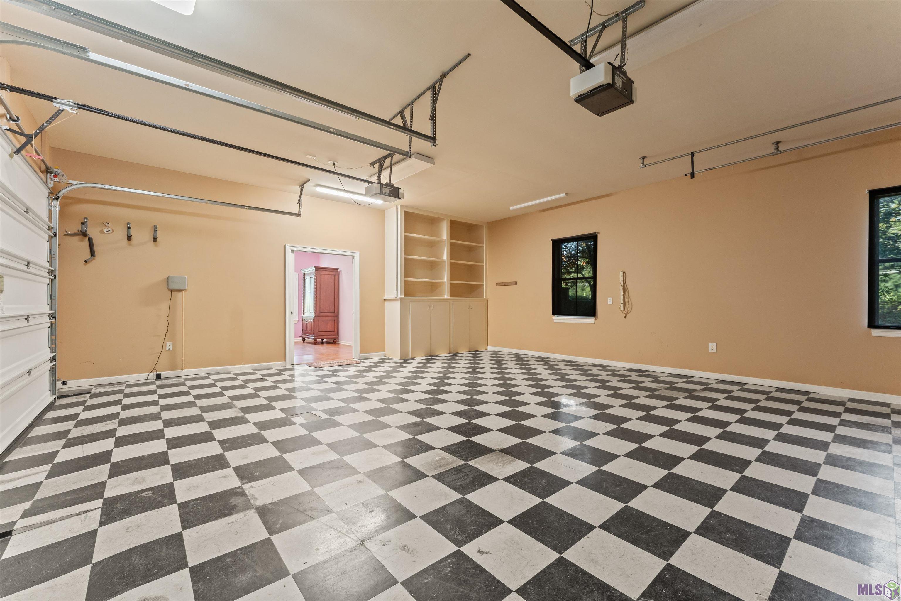 36408 Rue Lamonte Prairieville, LA 70769 - Photo 25 of 40 Garage with work bench and storage