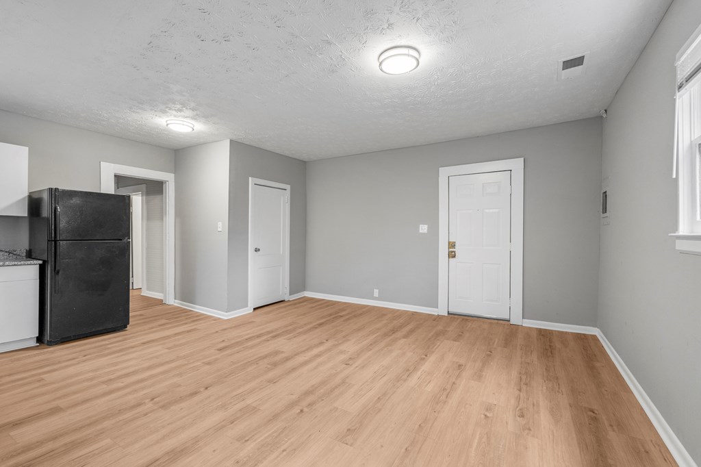 1301 20th Street Columbus, GA 31901 - Photo 13 of 16 a view of empty room with wooden floor