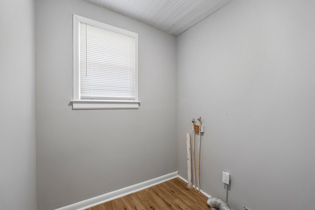 1301 20th Street Columbus, GA 31901 - Photo 6 of 16 a view of room with window and wooden floor