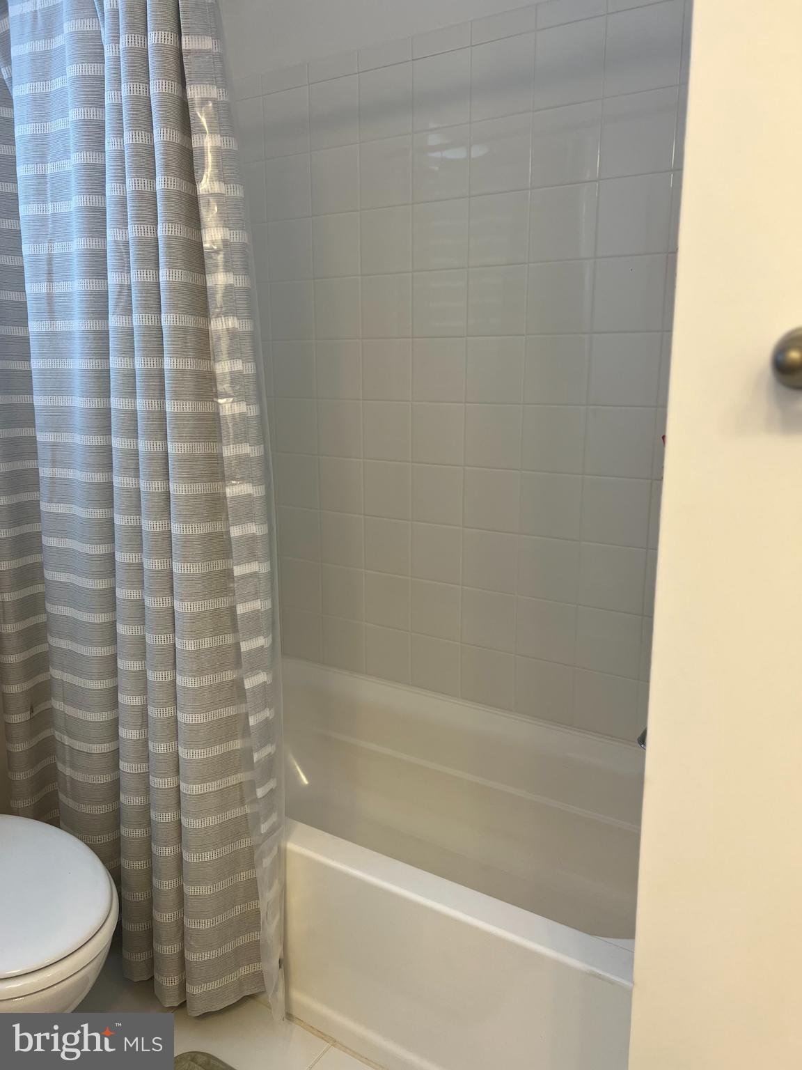 738-7 Tatum Court Frederick, MD 21702 - Photo 16 of 19 a bathroom with a shower and a toilet