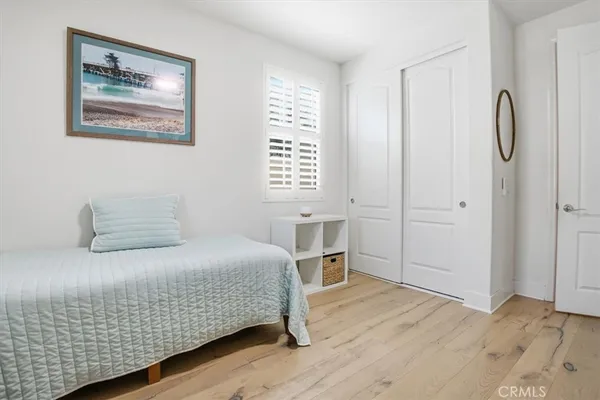 a bedroom with a bed and a table