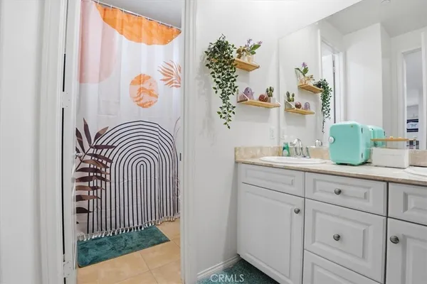 a bathroom with a sink and mirror