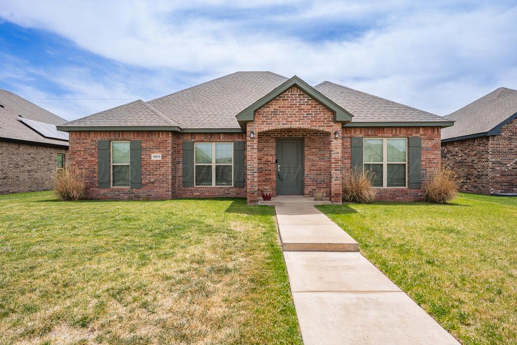 front view of a house with a yard