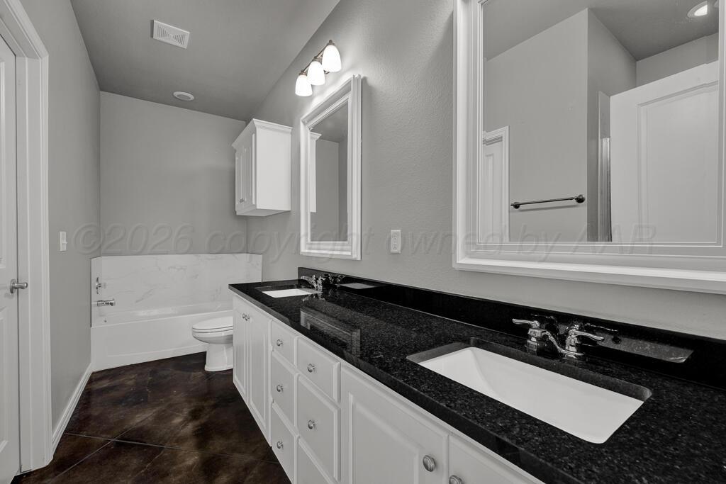 9919 Addelyn Avenue Amarillo, TX 79119 - Photo 12 of 23 a bathroom with a sink and a bathtub