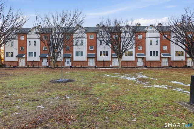 a view of a building with a large tree