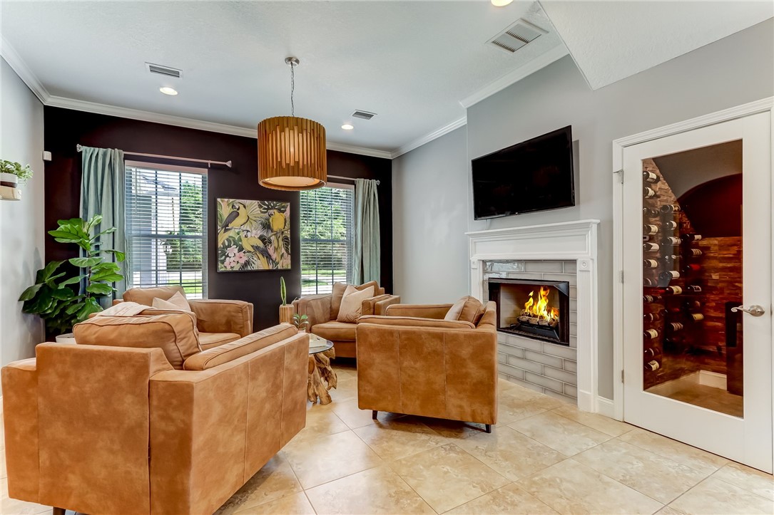 96266 Dowling Drive Yulee, FL 32097 - Photo 10 of 35 a living room with furniture fireplace and flat screen tv