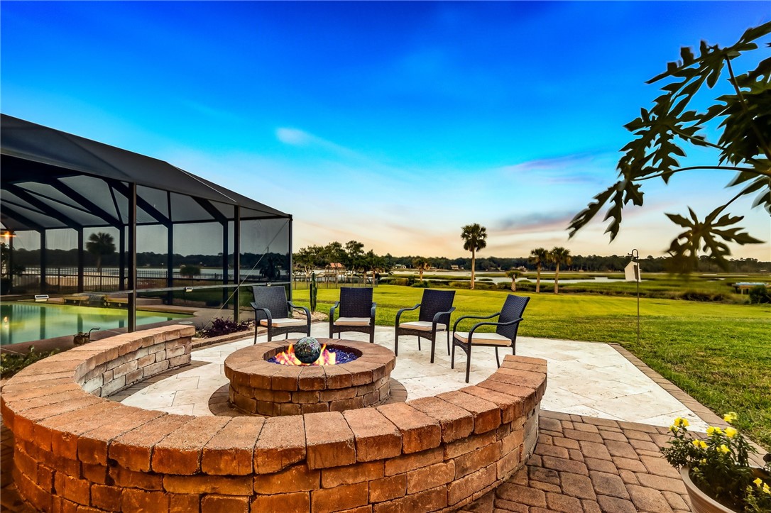 96266 Dowling Drive Yulee, FL 32097 - Photo 2 of 35 a view of a swimming pool with outdoor seating