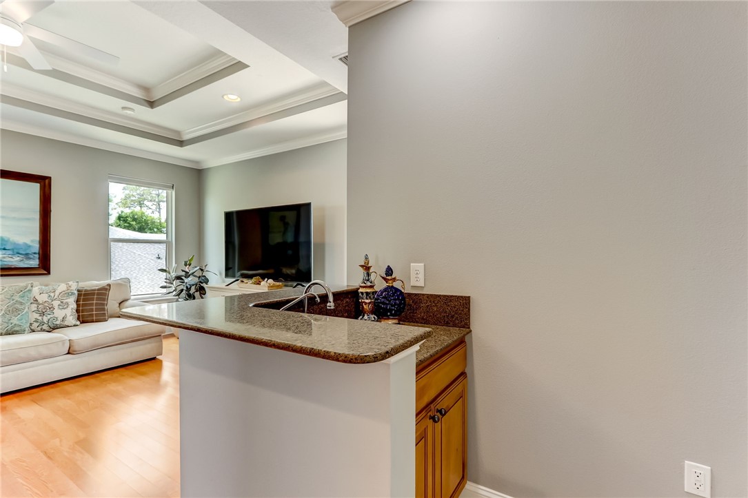 96266 Dowling Drive Yulee, FL 32097 - Photo 19 of 35 a living room with furniture and a flat screen tv