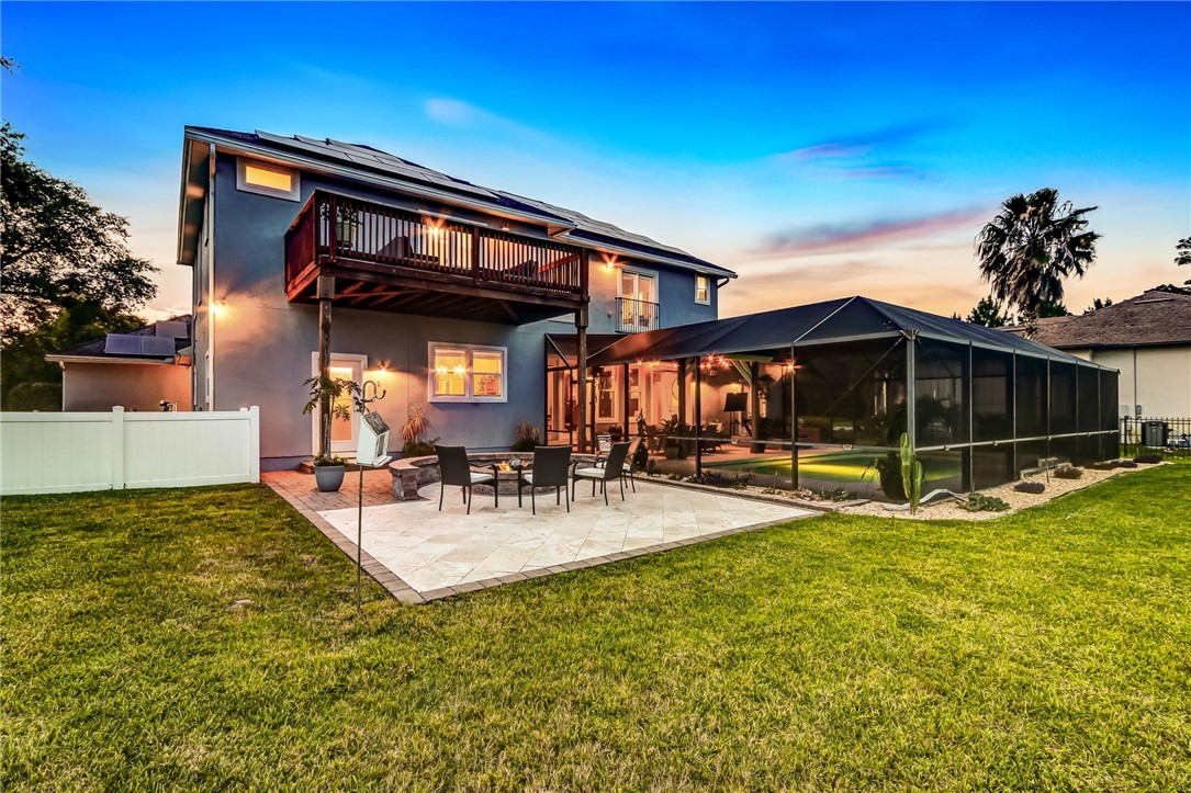 96266 Dowling Drive Yulee, FL 32097 - Photo 32 of 35 a view of a house with swimming pool and sitting area