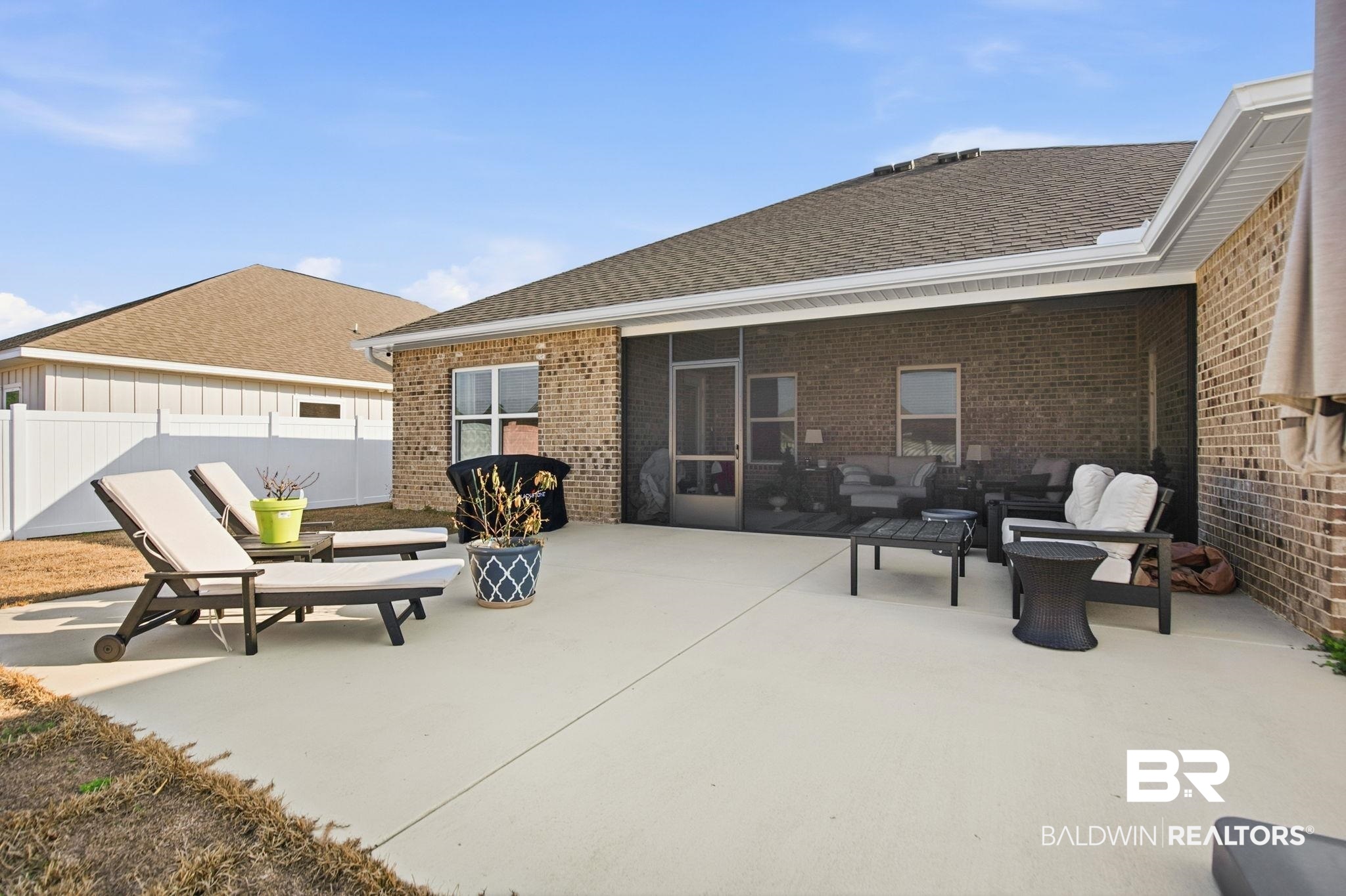 11123 Genuine Risk Circle Daphne, AL 36526 - Photo 52 of 67 View of patio / terrace featuring a sunroom and outdoor seating