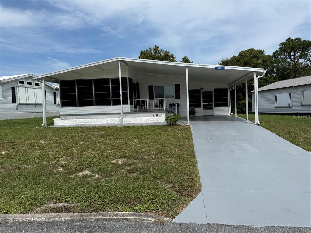 9074 Highpoint Boulevard Brooksville, FL 34613 - Photo 1 of 1 a front view of a house with garden
