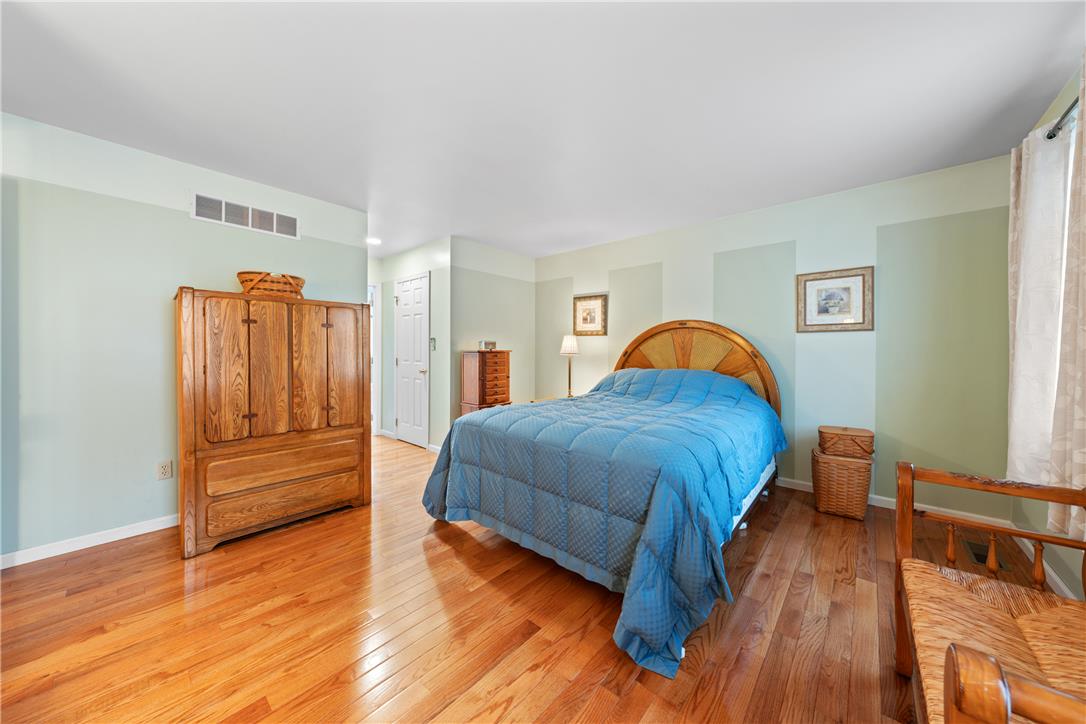 4568 Greenfield Road Bethlehem, PA 18017 - Photo 24 of 59 Rich hardwood flooring stretches across this naturally illuminated bedroom.