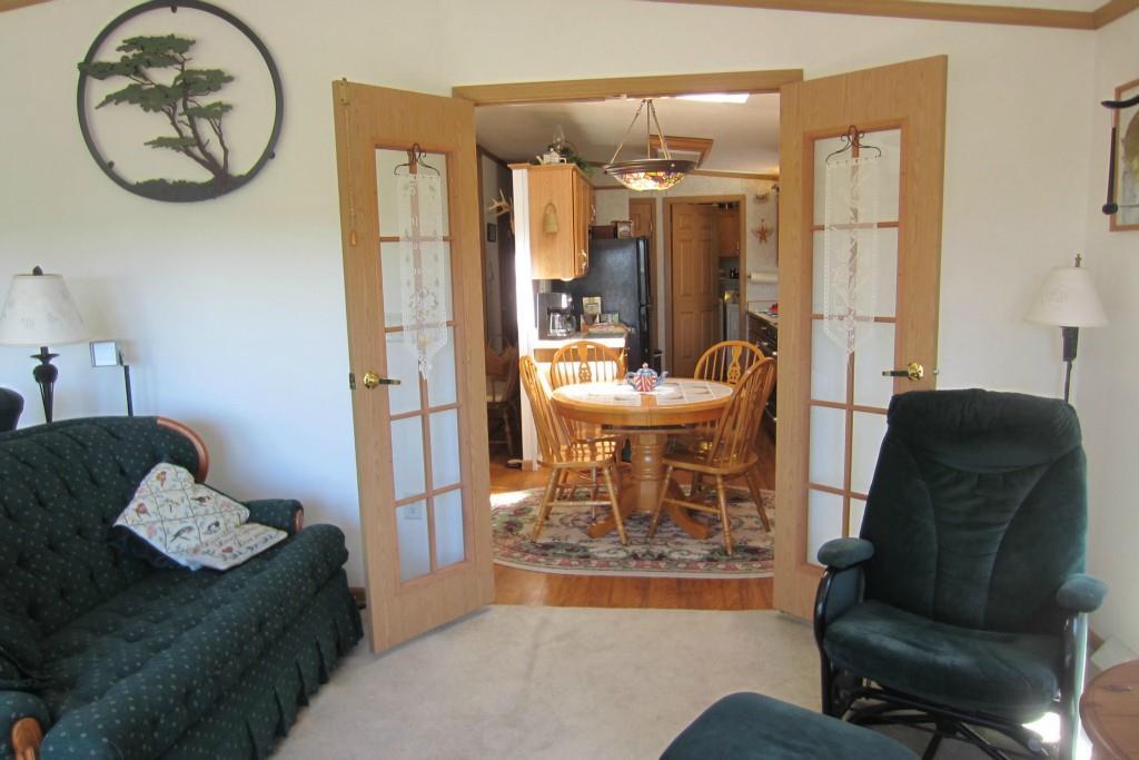 65 Pit Road Phippsburg, ME 04562 - Photo 7 of 35 Frend doors separate the sunroom and...