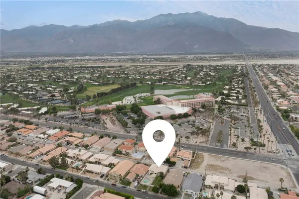 an aerial view of a house with a garden