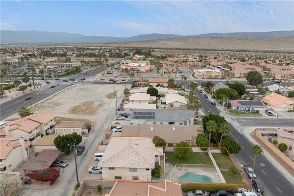 an aerial view of residential house with outdoor space and swimming pool