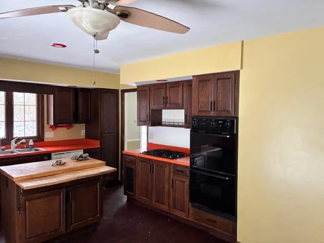 a kitchen with a stove and a refrigerator