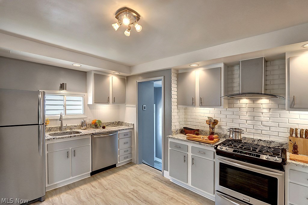4121 Stonehaven Road Cleveland, OH 44121 - Photo 5 of 21 Spectacular transformation of the kitchen.. granite counter tops, stainless steel appliances, stylish vent hood, new lighting... you'll love it!