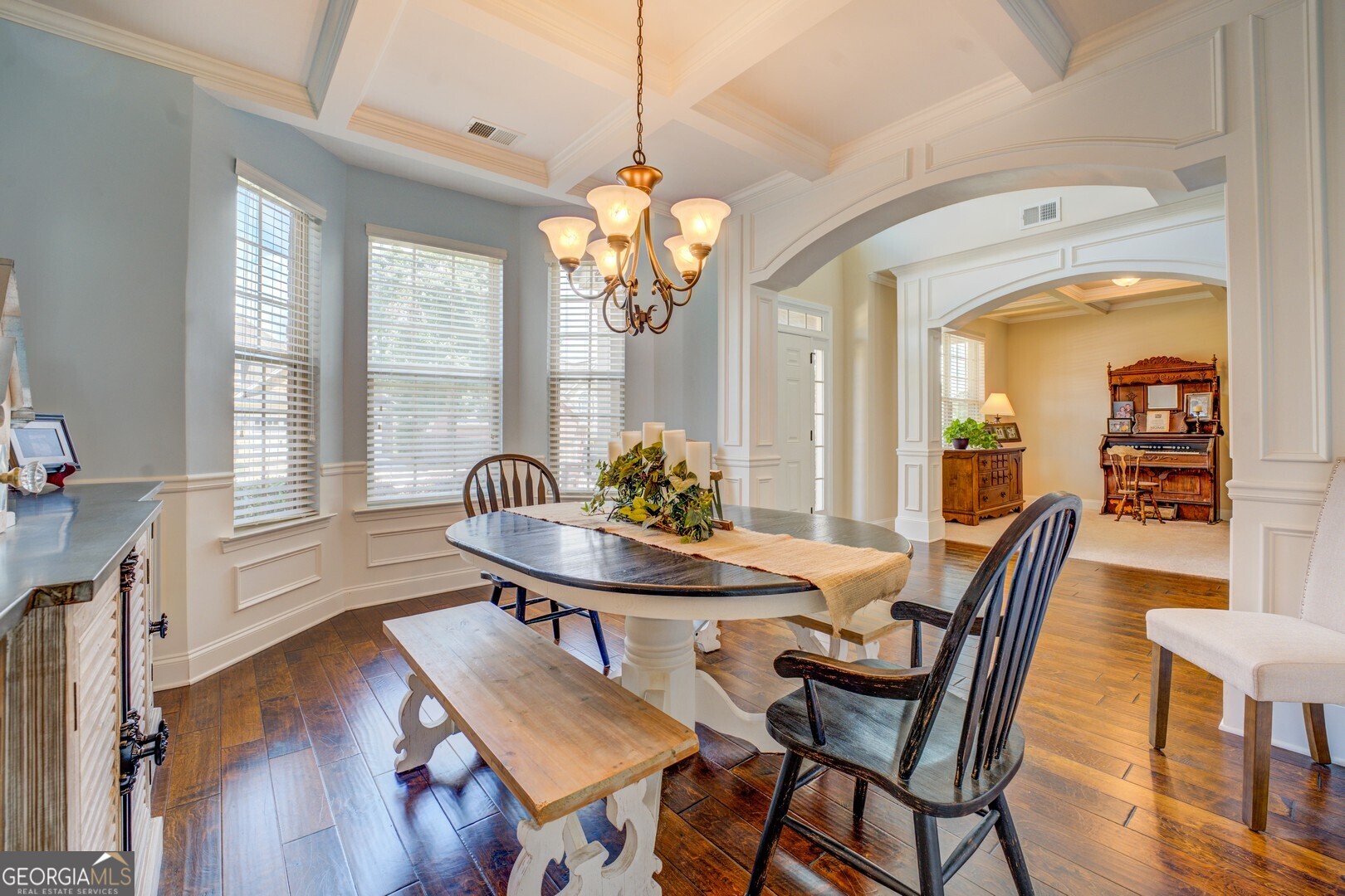 312 Relative Trail McDonough, GA 30253 - Photo 12 of 54 a view of a dining room with furniture and wooden floor