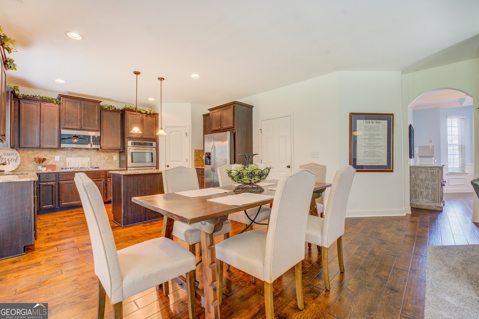 312 Relative Trail McDonough, GA 30253 - Photo 14 of 54 a view of a dining room with furniture and wooden floor