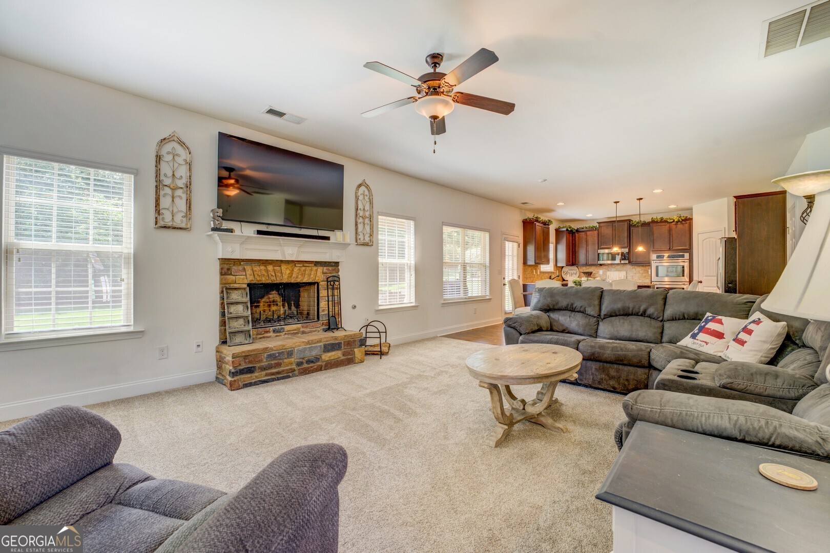312 Relative Trail McDonough, GA 30253 - Photo 24 of 54 a living room with furniture and a fireplace