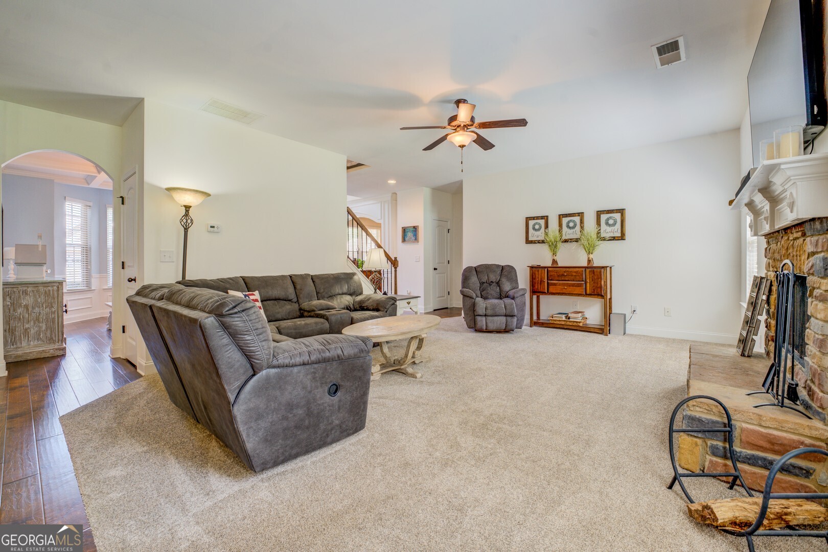 312 Relative Trail McDonough, GA 30253 - Photo 26 of 54 a living room with furniture a flat screen tv and a large window