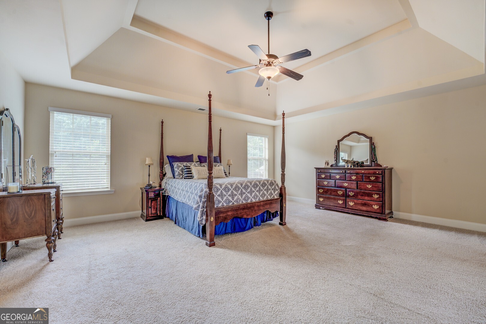 312 Relative Trail McDonough, GA 30253 - Photo 28 of 54 a bedroom with bed and a chandelier