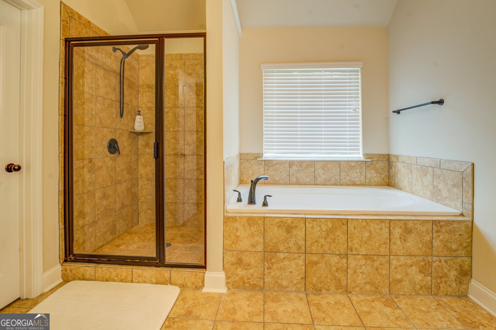 312 Relative Trail McDonough, GA 30253 - Photo 34 of 54 a bathroom with a bathtub and shower