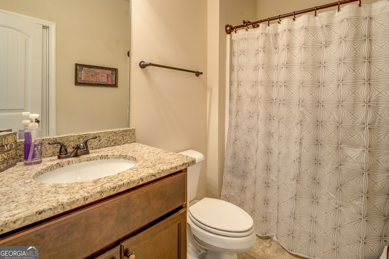 312 Relative Trail McDonough, GA 30253 - Photo 46 of 54 a bathroom with a granite countertop sink toilet and a mirror
