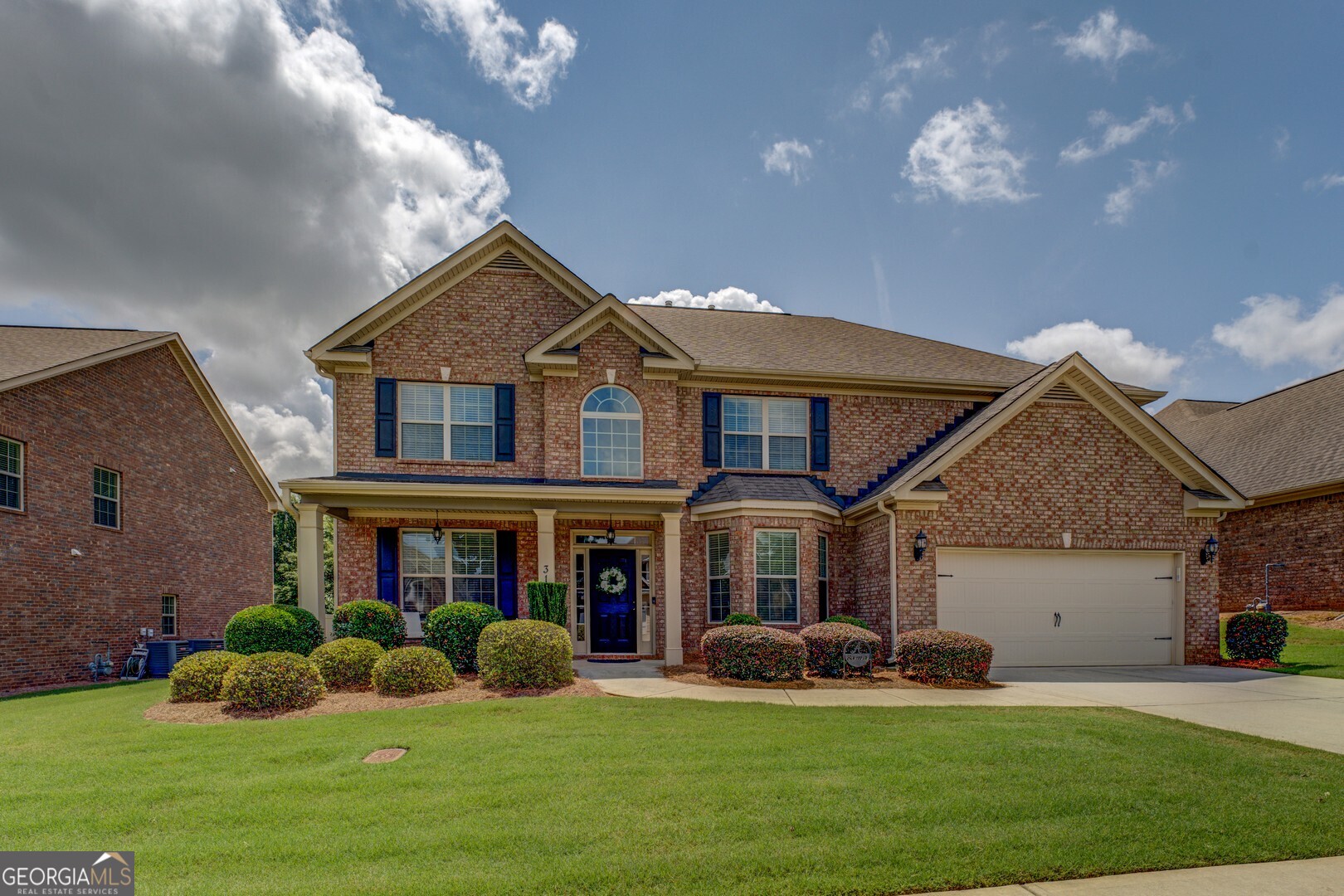 312 Relative Trail McDonough, GA 30253 - Photo 54 of 54 a front view of a house with a yard and garage
