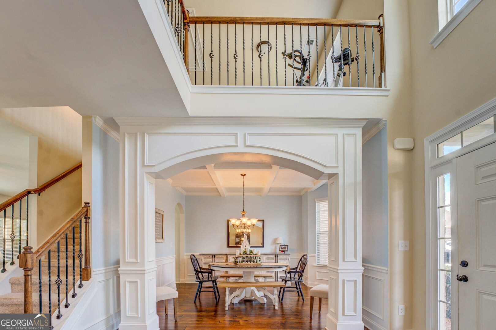 312 Relative Trail McDonough, GA 30253 - Photo 10 of 54 a view of a hallway with dining room and chandelier