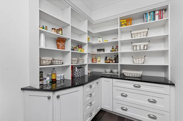 an outdoor sitting area with furniture and garden