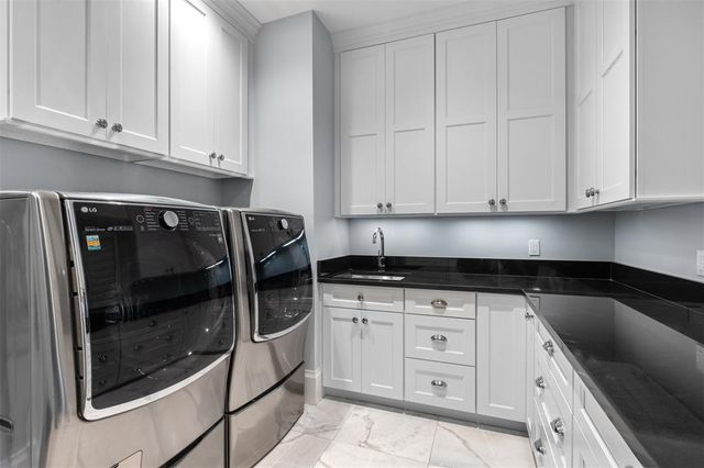 a view of a house with swimming pool and sitting area